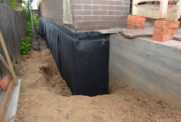 Happy homeowners after waterproofing job in Cookstown
